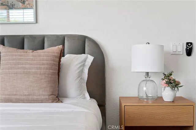 a bedroom with a bed and window