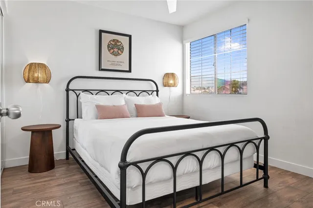 a bedroom with a bed and window