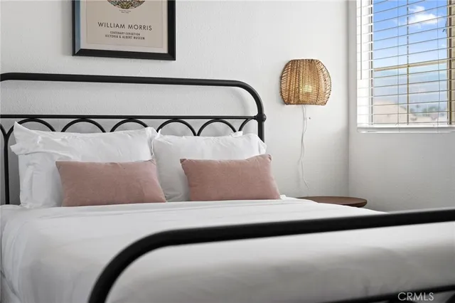 a bathroom with a toilet a sink and a mirror