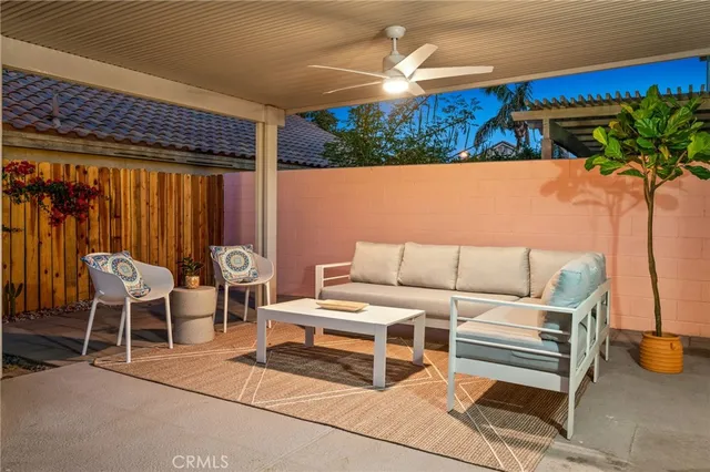 a outdoor living space with furniture and a potted plant