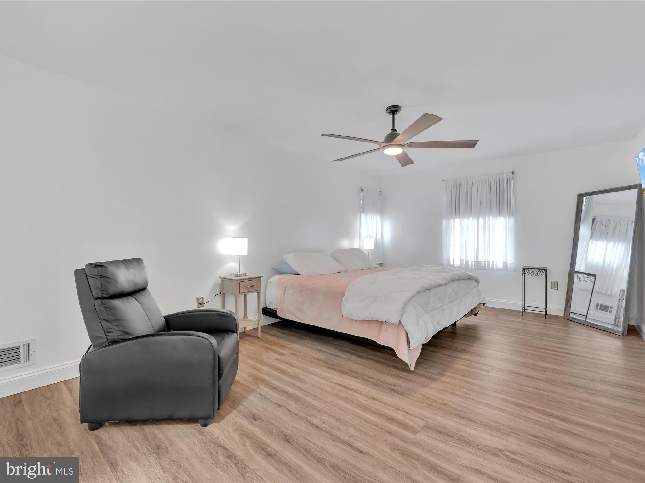 27 Flint Ridge Drive Reading, PA 19607 - Photo 16 of 31 a bedroom with a bed couch chandelier and a window