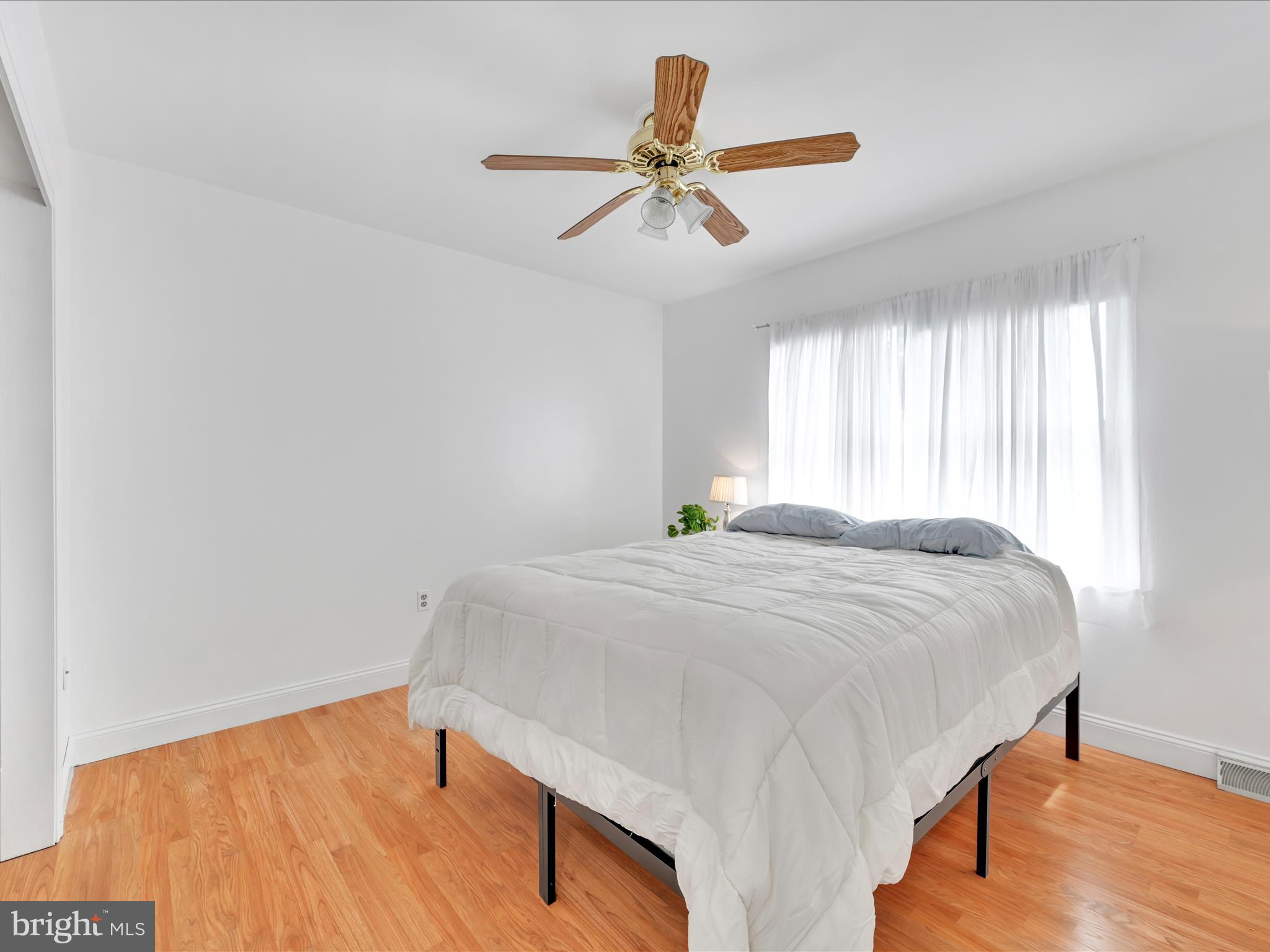 27 Flint Ridge Drive Reading, PA 19607 - Photo 22 of 31 a bedroom with a bed and a chandelier