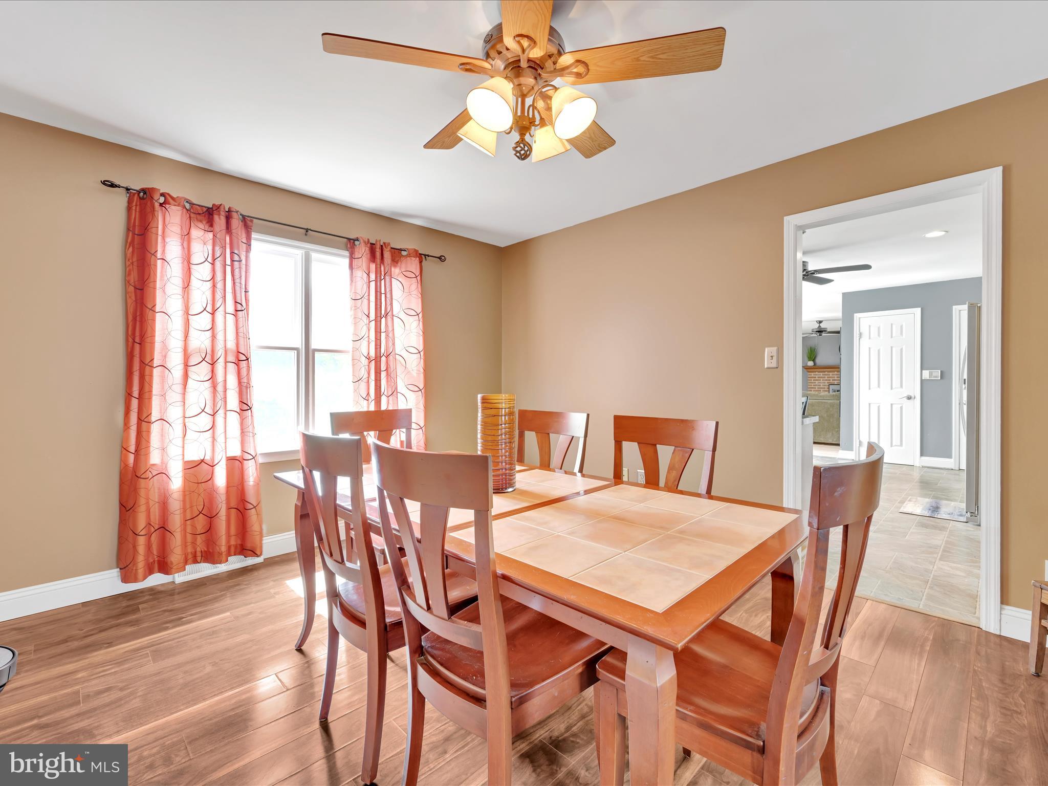 27 Flint Ridge Drive Reading, PA 19607 - Photo 7 of 31 a view of a dining room with furniture window and wooden floor