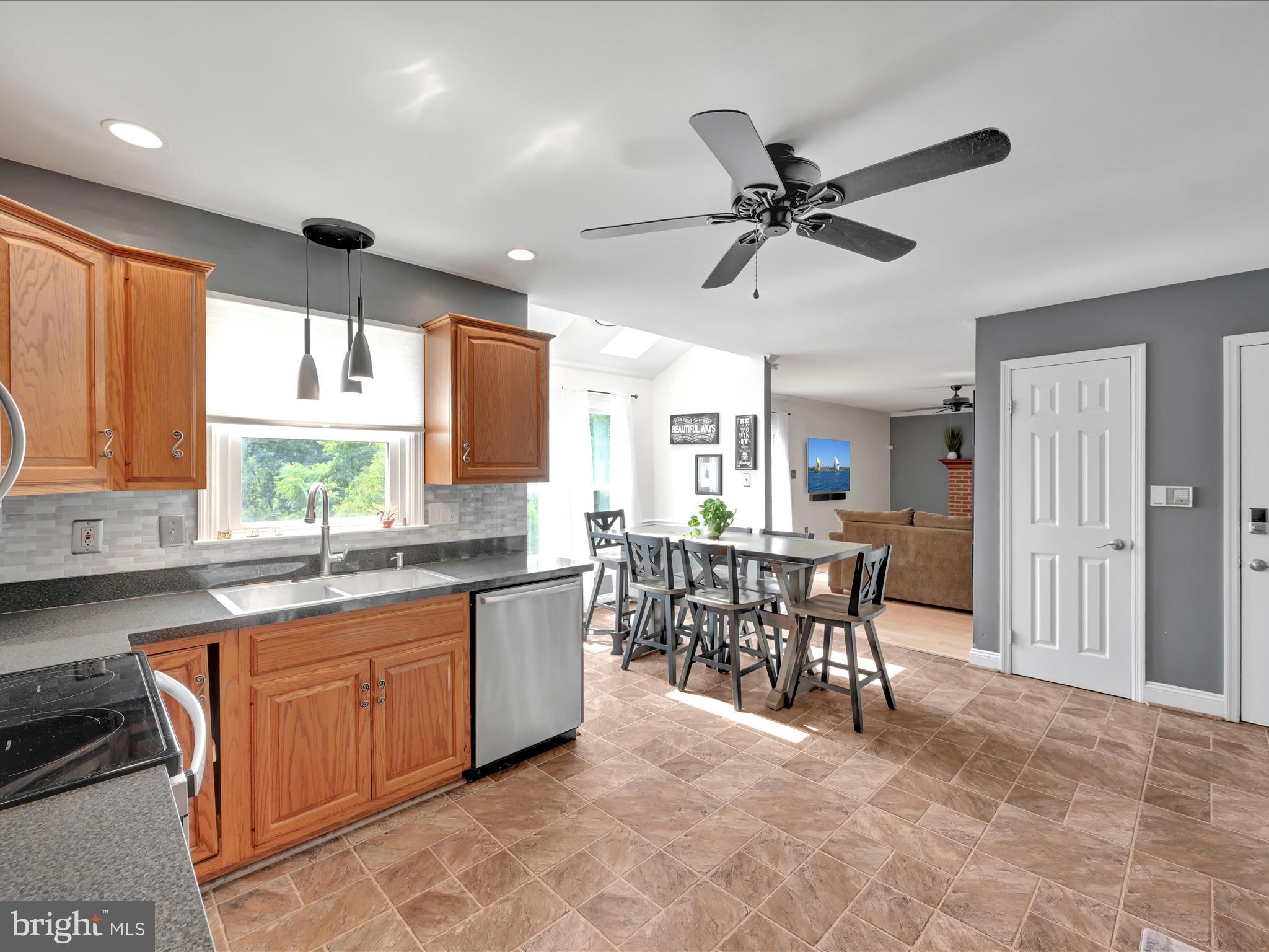 27 Flint Ridge Drive Reading, PA 19607 - Photo 10 of 31 a kitchen with a table chairs sink and cabinets