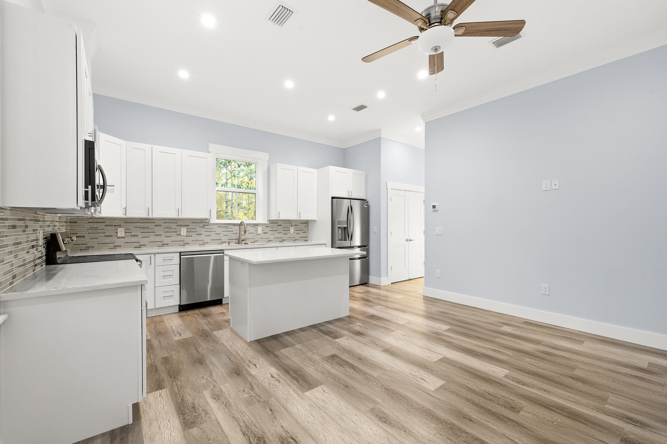 1272 Indian Woman Road Santa Rosa Beach, FL 32459 - Photo 6 of 24 a large kitchen with a lot of counter space and wooden floor