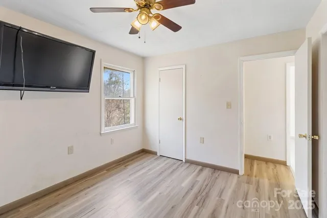 a view of livingroom with hardwood floor and hallway