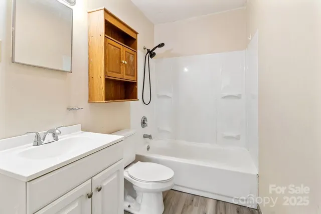 a bathroom with a sink a toilet and a bathtub
