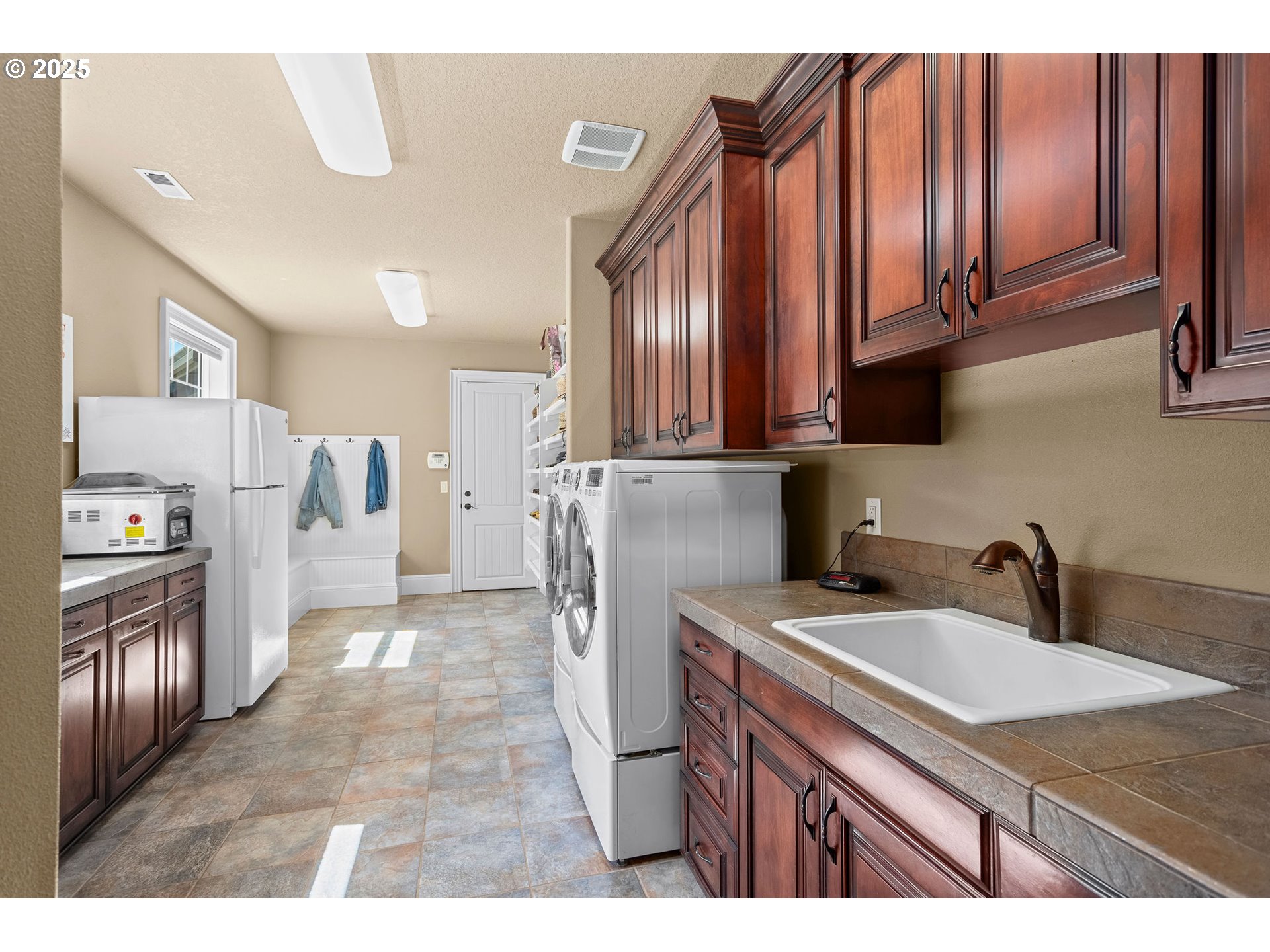 8438 Cascade Highway Northeast Silverton, OR 97381 - Photo 16 of 48 a kitchen view with granite countertop a sink a stove and refrigerator