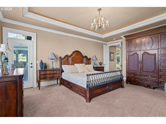 a bedroom with furniture and a chandelier