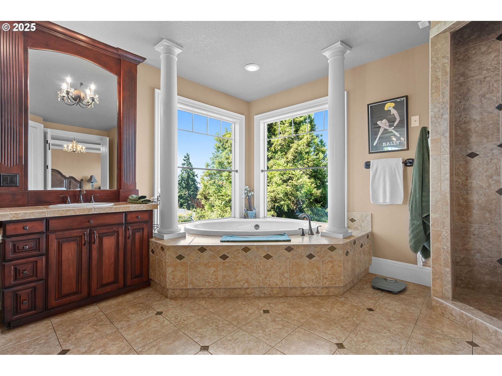 8438 Cascade Highway Northeast Silverton, OR 97381 - Photo 23 of 48 a bathroom with a tub a sink and a large mirror