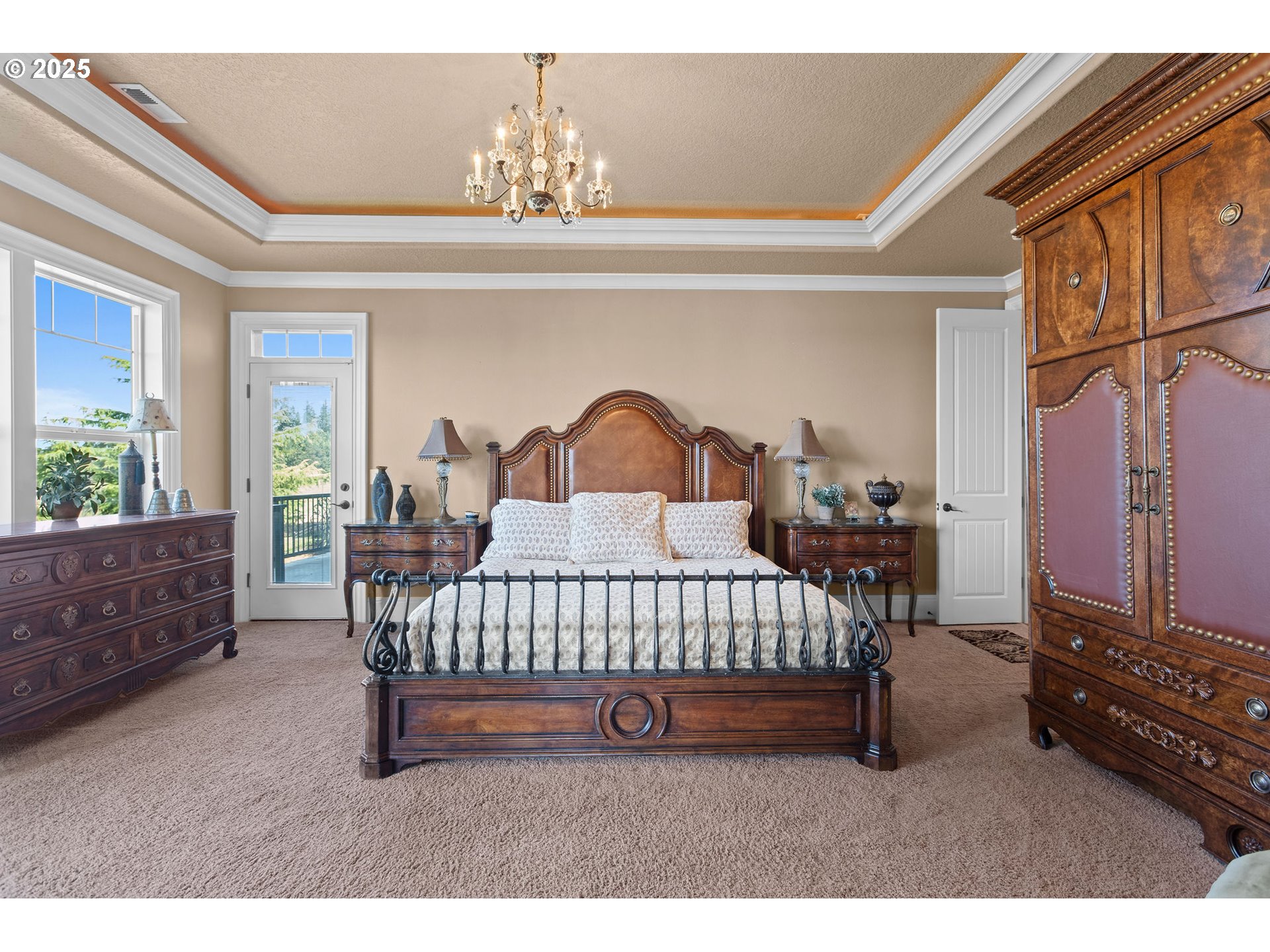 8438 Cascade Highway Northeast Silverton, OR 97381 - Photo 25 of 48 a bedroom with furniture and a chandelier