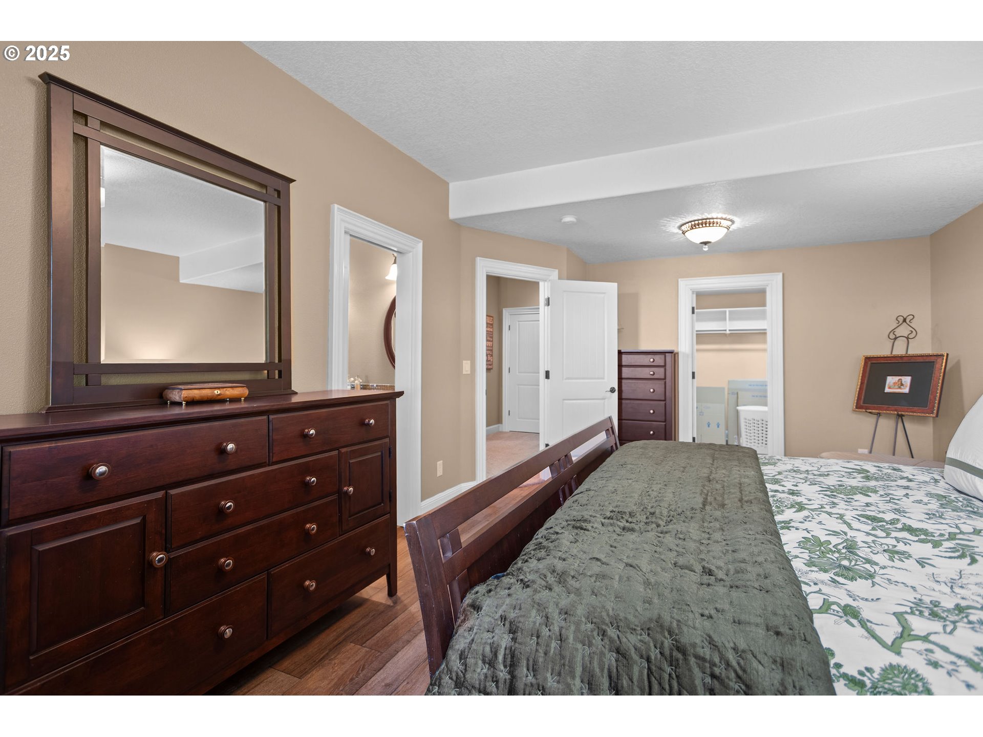 8438 Cascade Highway Northeast Silverton, OR 97381 - Photo 35 of 48 a bedroom with a bed and a mirror on dresser