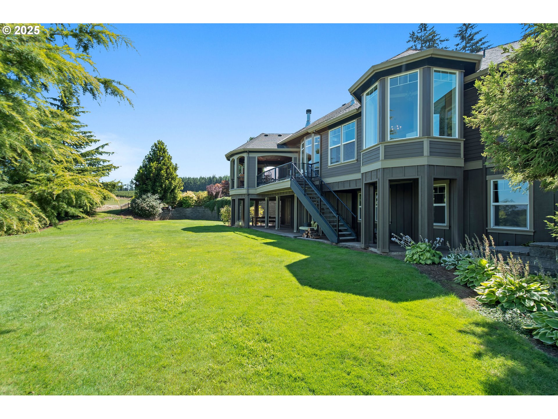8438 Cascade Highway Northeast Silverton, OR 97381 - Photo 45 of 48 a view of a house with a yard and potted plants