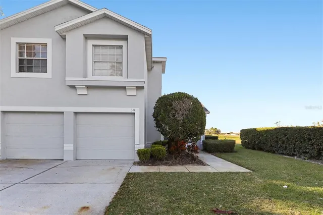 a view of a house with backyard porch and outdoor seating