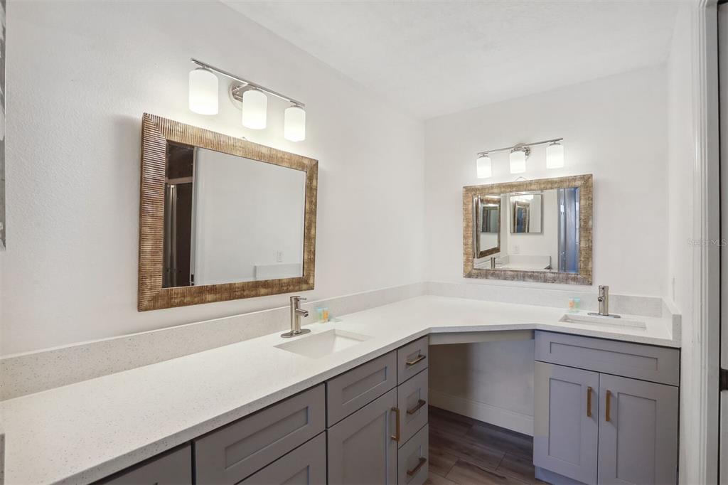 312 Eagle Ridge Drive, Unit 312 Davenport, FL 33837 - Photo 15 of 39 a bathroom with a sink vanity and mirror