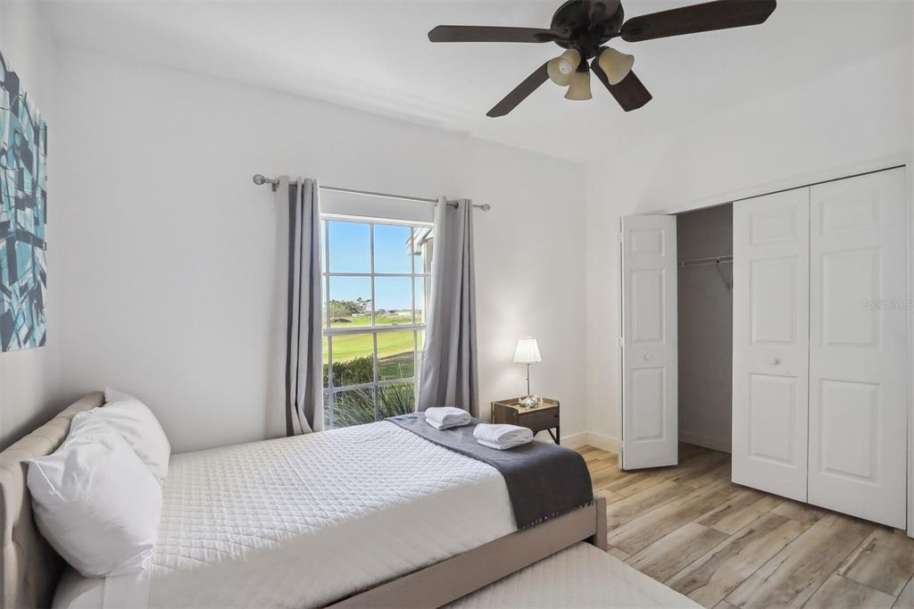 312 Eagle Ridge Drive, Unit 312 Davenport, FL 33837 - Photo 16 of 39 a bedroom with a bed and a window