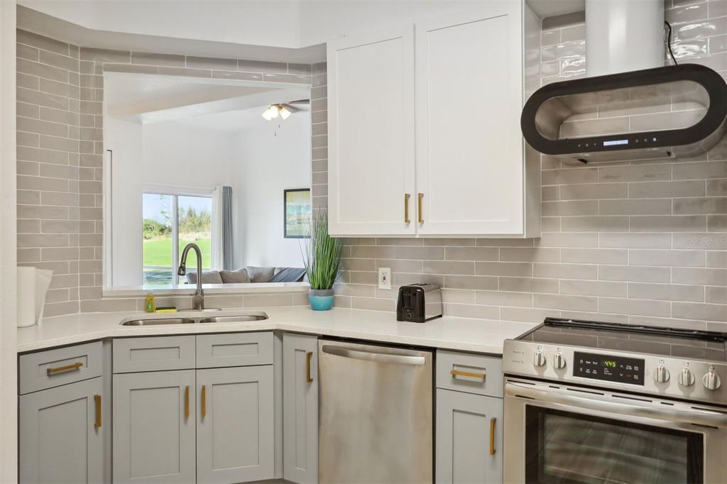312 Eagle Ridge Drive, Unit 312 Davenport, FL 33837 - Photo 17 of 39 a kitchen with a sink cabinets and appliances