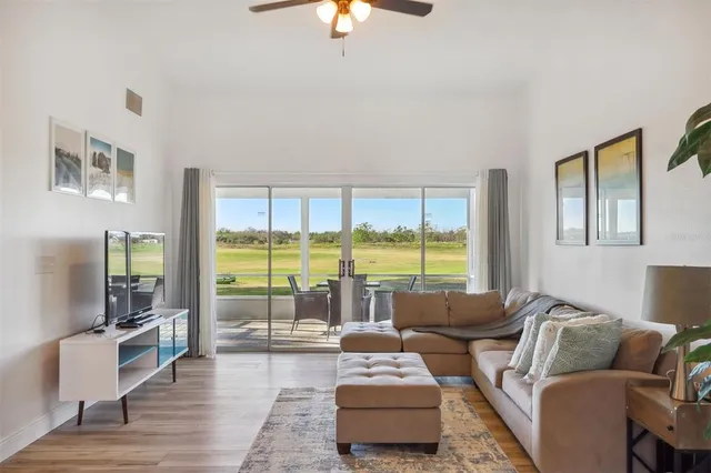 a living room with furniture and a large window