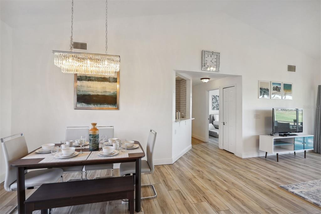 312 Eagle Ridge Drive, Unit 312 Davenport, FL 33837 - Photo 25 of 39 a view of a dining room with furniture and wooden floor