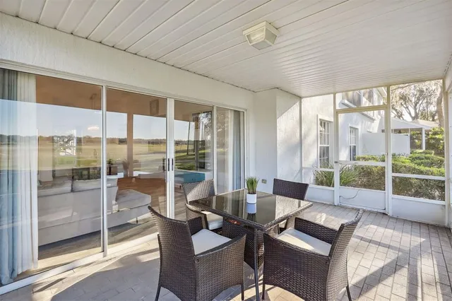 a view of a dining room with furniture wooden floor and glass door