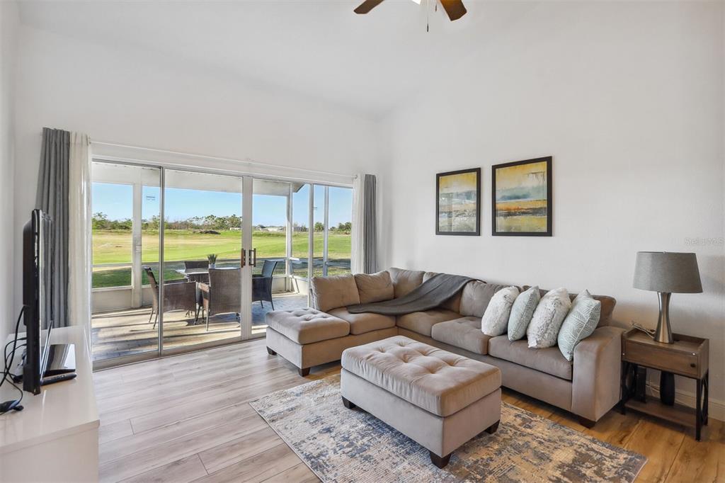 312 Eagle Ridge Drive, Unit 312 Davenport, FL 33837 - Photo 36 of 39 a living room with furniture and a large window