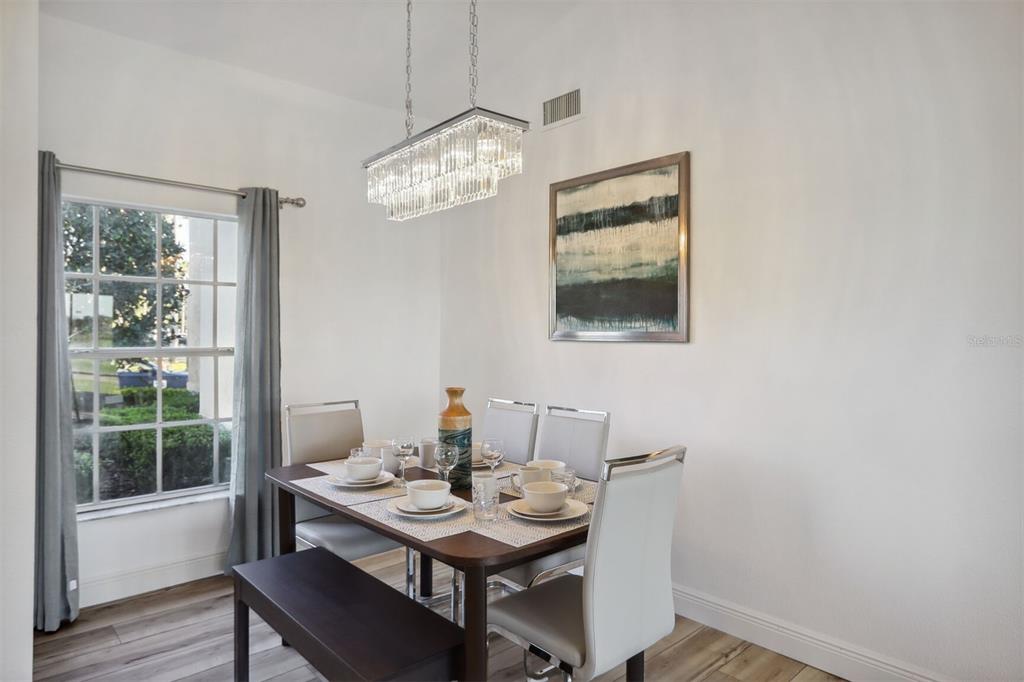 312 Eagle Ridge Drive, Unit 312 Davenport, FL 33837 - Photo 39 of 39 a view of a dining room with furniture window and wooden floor