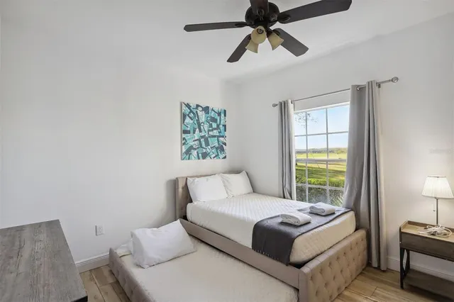 a bedroom with a bed and a window