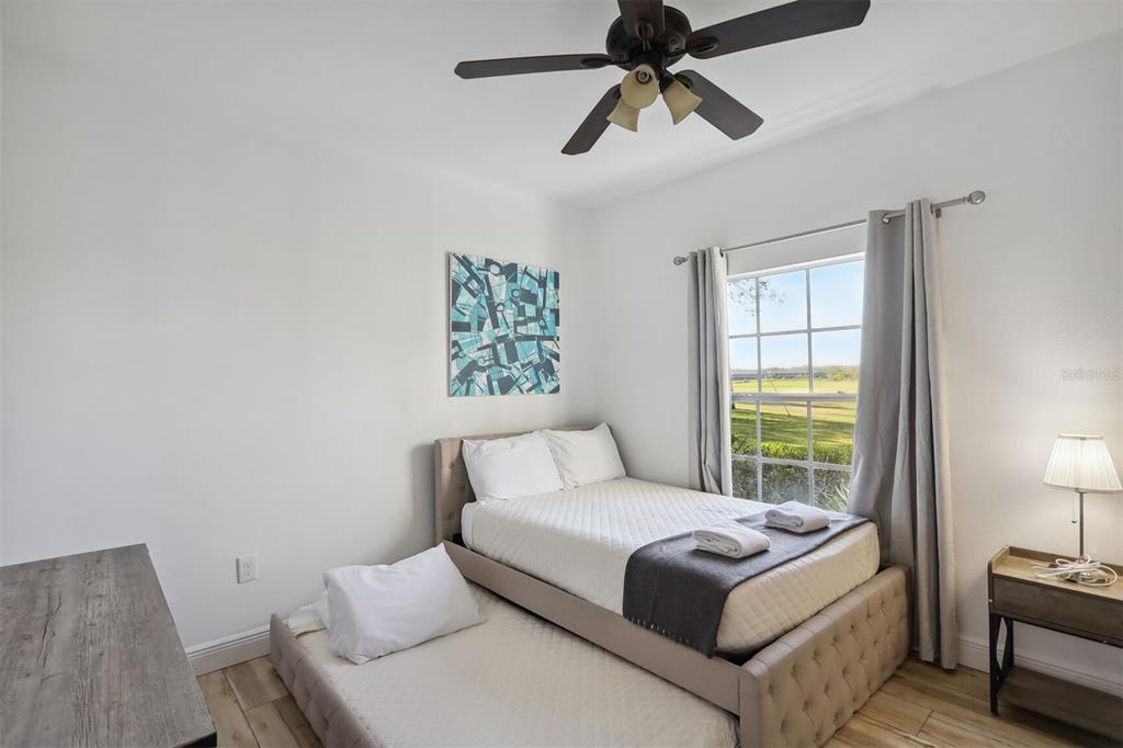 312 Eagle Ridge Drive, Unit 312 Davenport, FL 33837 - Photo 9 of 39 a bedroom with a bed and a window