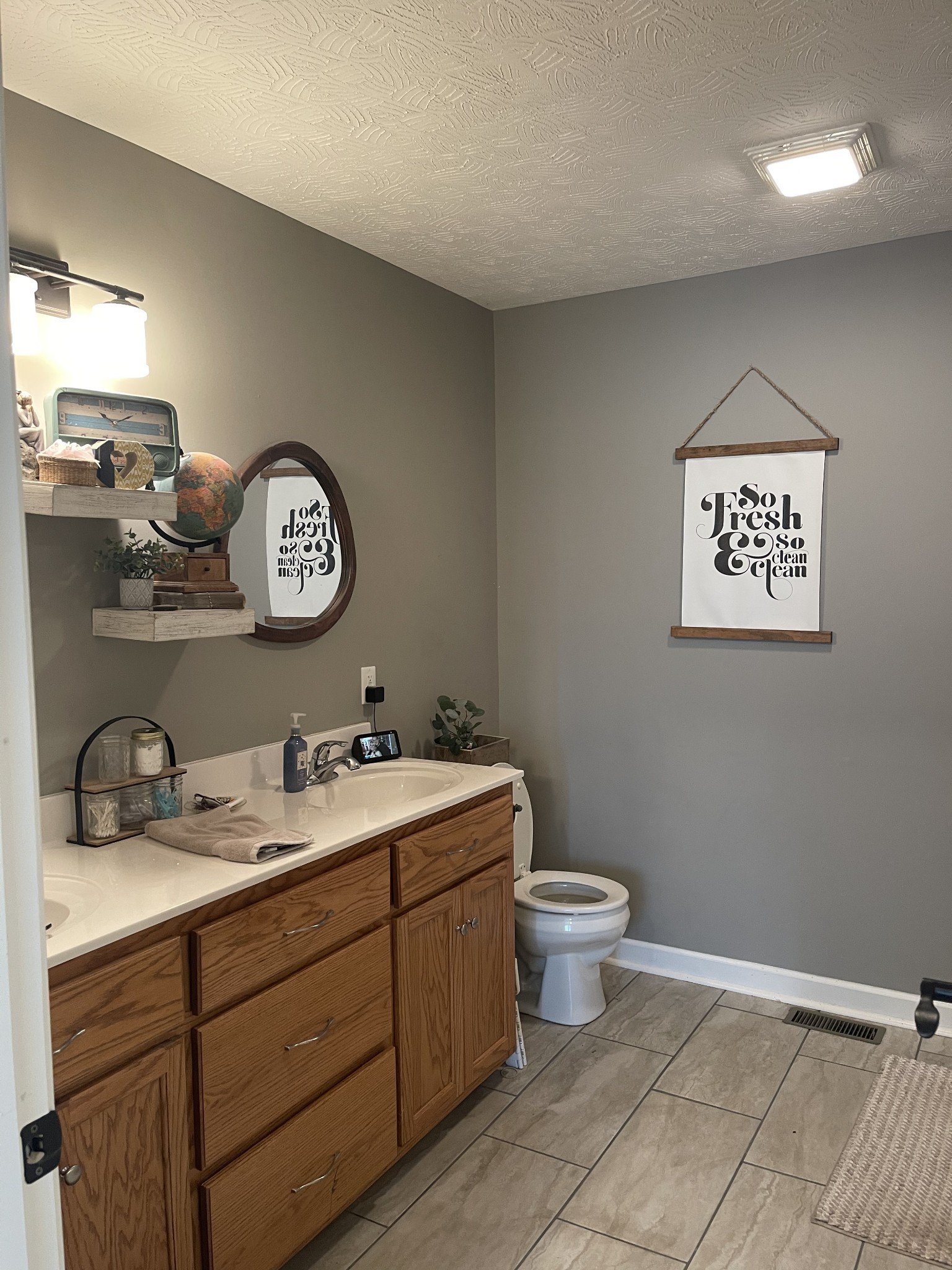 81 Butler Road Lafayette, TN 37083 - Photo 6 of 11 a bathroom with a toilet sink and mirror