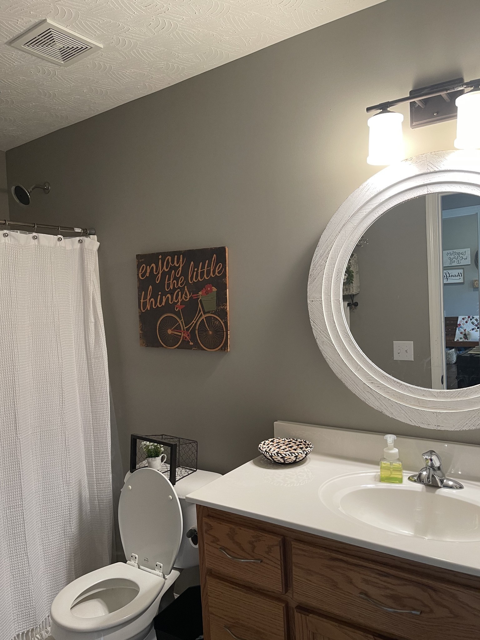 81 Butler Road Lafayette, TN 37083 - Photo 10 of 11 a bathroom with a toilet sink and mirror