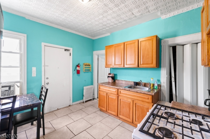 183 Walnut Street Paterson, NJ 07522 - Photo 23 of 37 a room with storage and utility
