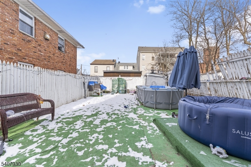 183 Walnut Street Paterson, NJ 07522 - Photo 7 of 37 a view of a backyard with furniture