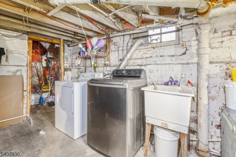 183 Walnut Street Paterson, NJ 07522 - Photo 9 of 37 a utility room with dryer and washer