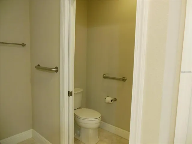 a bathroom with a granite countertop sink