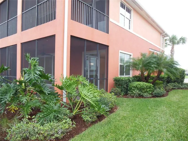 a view of a house with a yard and plants