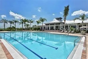 a view of a swimming pool with a patio