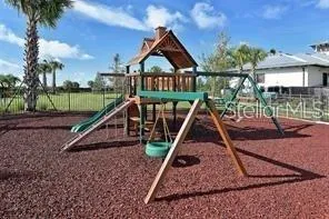 a view of a patio with table and chairs potted plants with floor to ceiling window