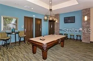 a living room with fireplace furniture and a chandelier