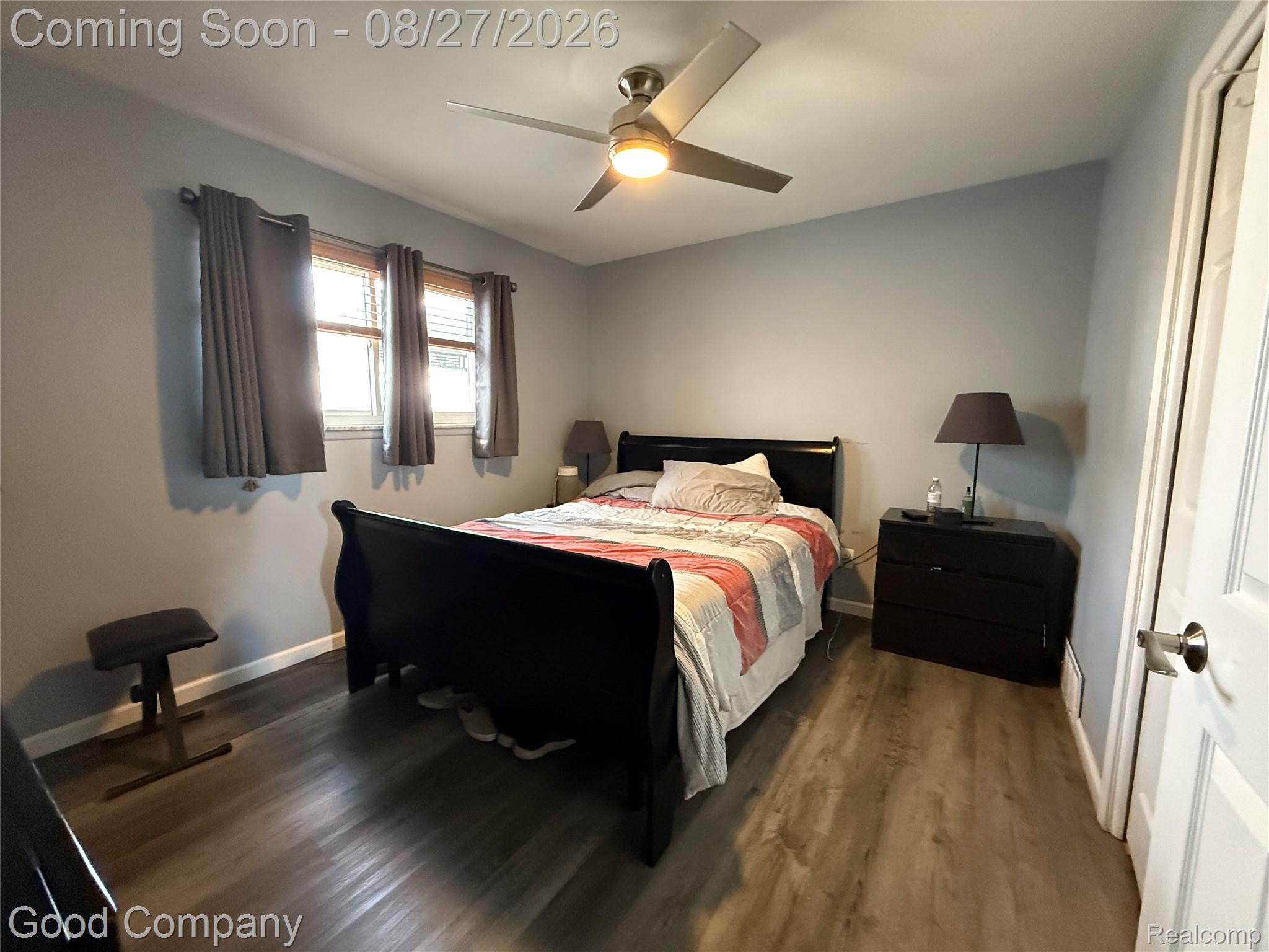 17941 East 13 Mile Road Fraser, MI 48026 - Photo 15 of 32 Wood-finish flooring throughout, two windows with blinds, and a ceiling fan with integrated lighting
