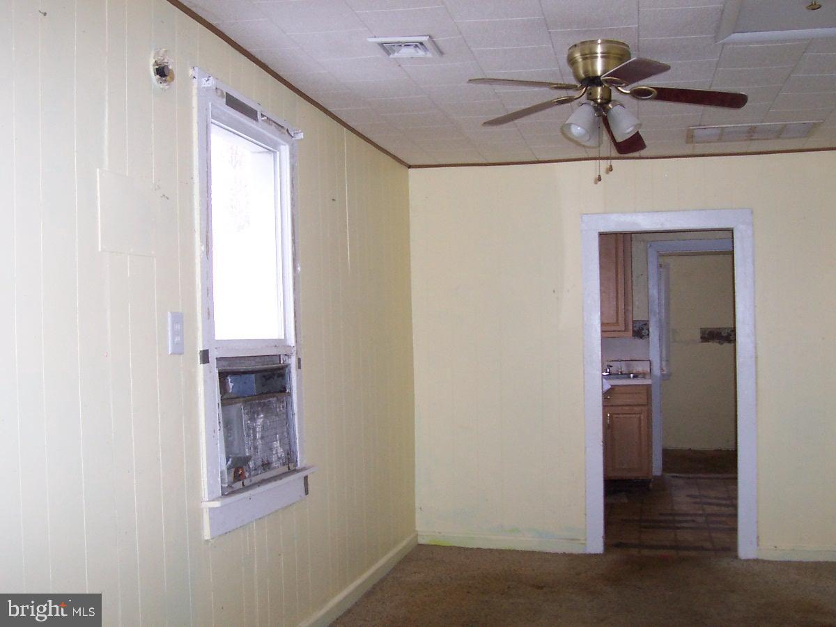 172 Boston Road Pennsville, NJ 08070 - Photo 4 of 8 a view of empty room with window