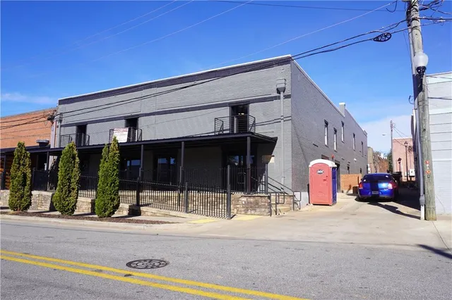 a view of a building with traffic signal lights