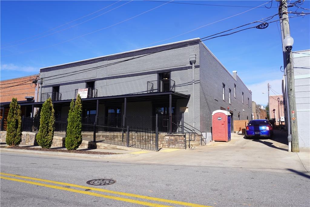 a view of a building with traffic signal lights