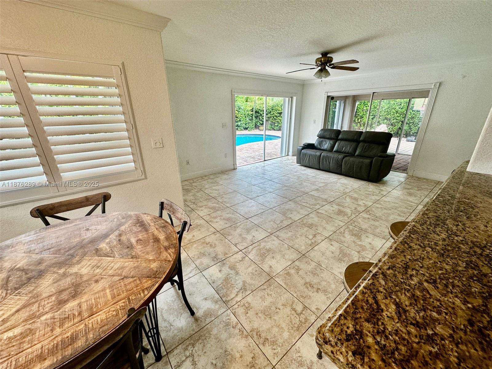 16335 Southwest 93rd Street Miami, FL 33196 - Photo 12 of 29 a bedroom with a bed and wooden floor