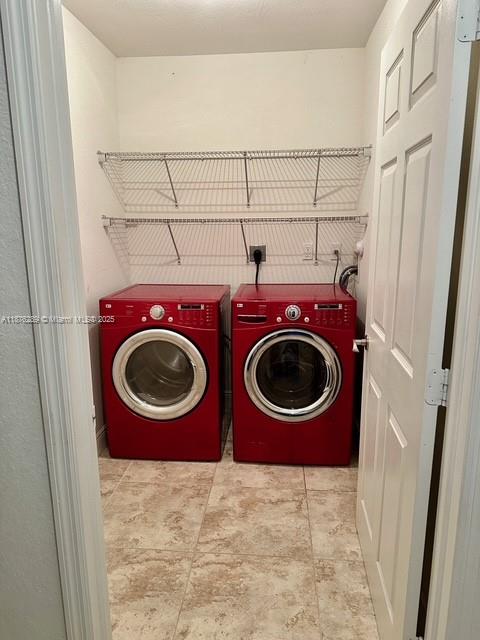 16335 Southwest 93rd Street Miami, FL 33196 - Photo 13 of 29 a utility room with dryer and washer