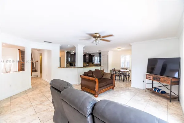 a kitchen with a sink a counter top stainless steel appliances and cabinets