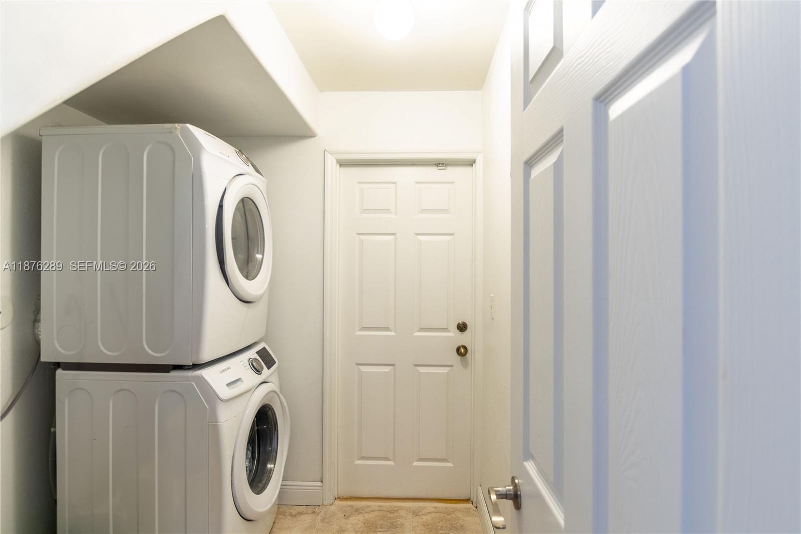 16335 Southwest 93rd Street Miami, FL 33196 - Photo 24 of 70 a utility room with dryer and washer