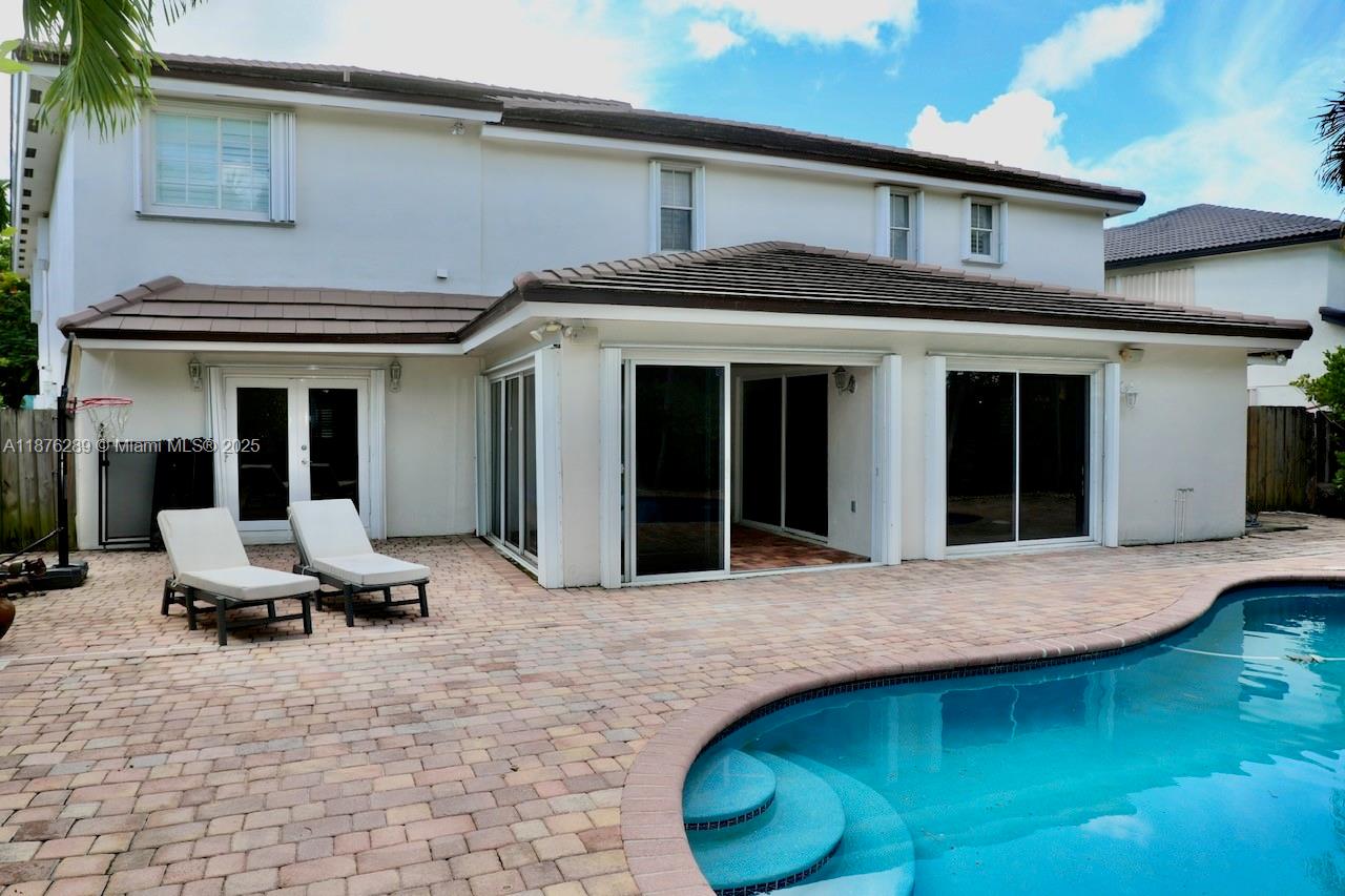 16335 Southwest 93rd Street Miami, FL 33196 - Photo 26 of 29 a view of the front door and lounge chair