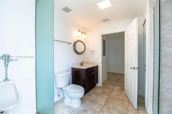 a bathroom with a sink and mirror