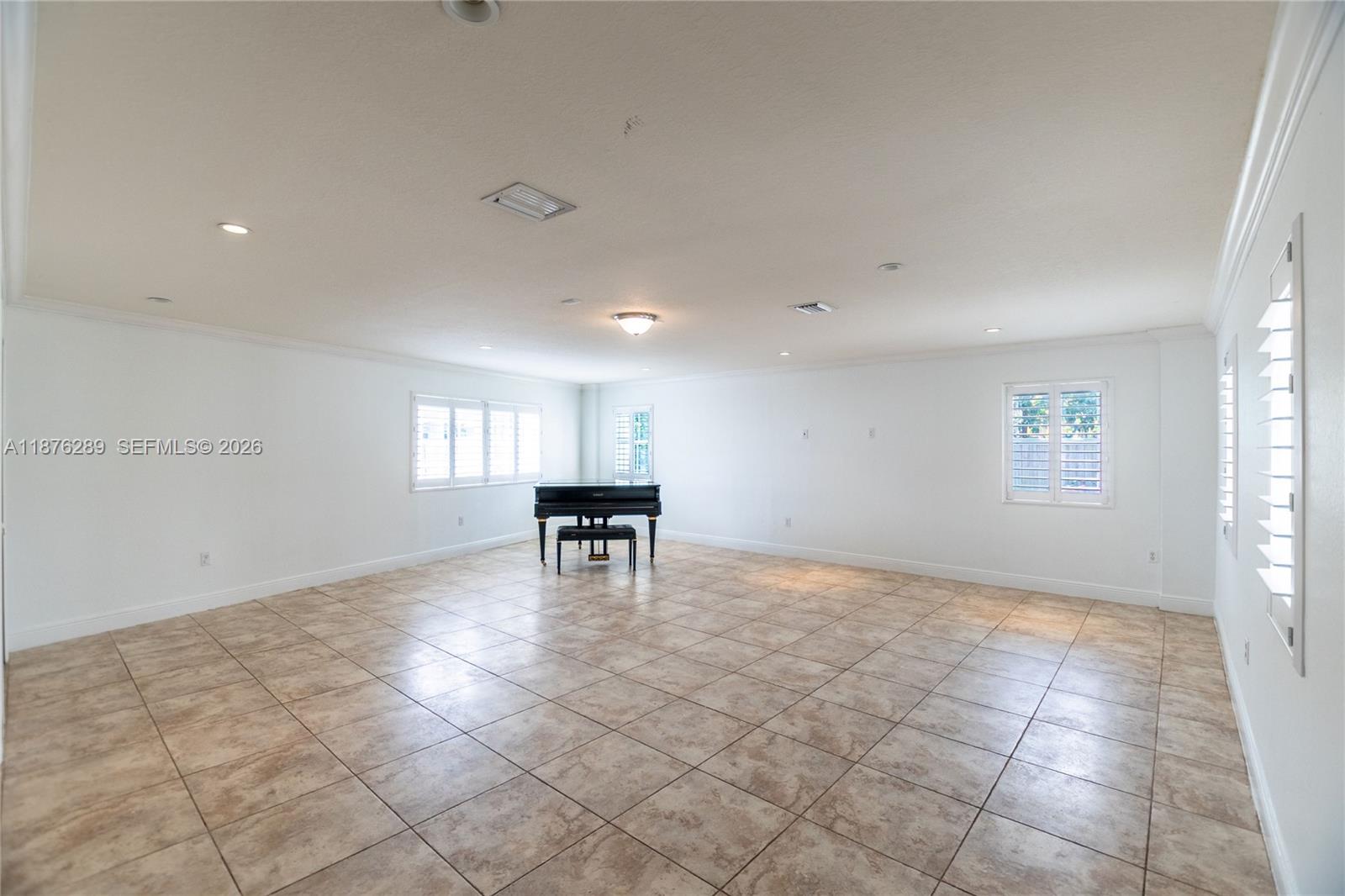 16335 Southwest 93rd Street Miami, FL 33196 - Photo 32 of 70 a view of an empty room with a window
