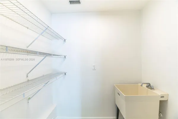 a bedroom with a bed and a mirror